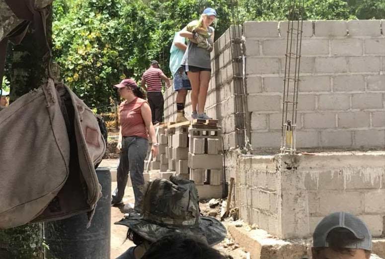 Volunteers building a church Girl in Honduras, via the efforts of Living Hope For Honduras.